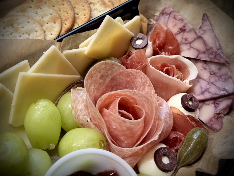 The Widow&rsquo;s Board: rolled salami roses, cheeses, grapes and mozzarella eyes